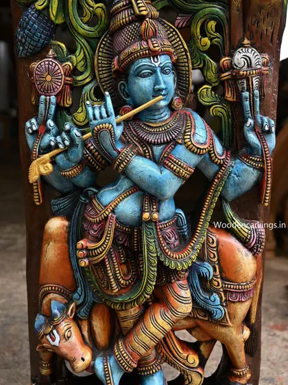 A magnificent 48-inch wall-mounted panel of Lord Krishna, hand-painted in a striking blue. This Jali work piece is a vibrant and artistic representation of Krishna with his cow, perfect as a statement wall art.