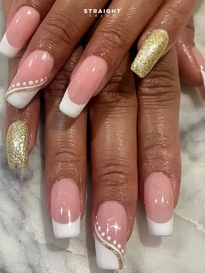 A close-up on the details of this French set, showing the clean smile lines and the beautiful gold glitter accent nail.