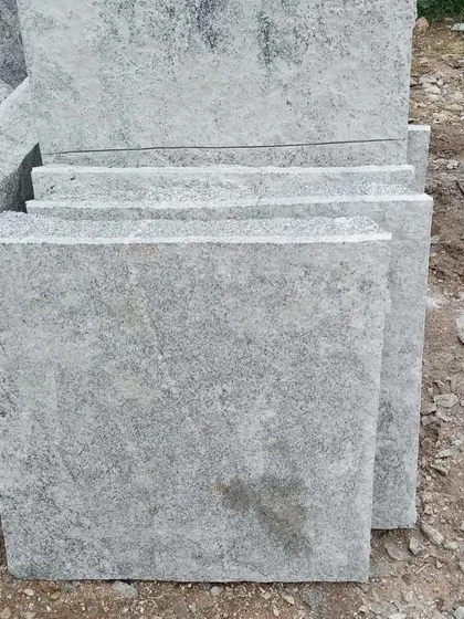 Square-cut rough stone pavers.