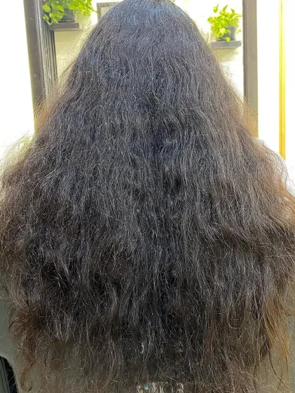 This client came in with a full mane that needed structure. By using my dry-cutting technique, I was able to carve out a shape that enhanced her curl clumps and gave her hair beautiful definition.