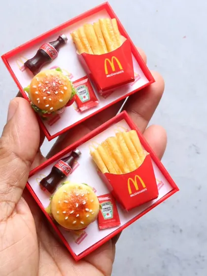 Two miniature McDonald's meal trays, perfect for magnets or dollhouse collections.