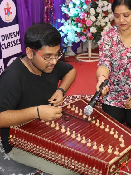 A student showcasing his musical talent on the santoor at the farewell party. We are proud to have such multi-talented individuals in our classes.