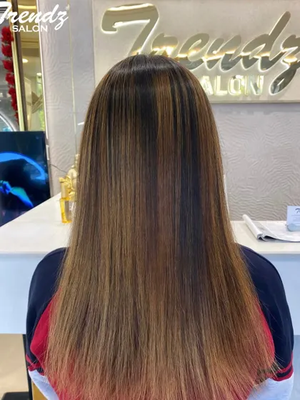 A beautiful example of a global color on long, straight hair. The result is a consistent, rich shade with a healthy, glossy finish.