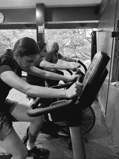 Clients work hard on the air bikes, a favorite for intense cardio sessions.