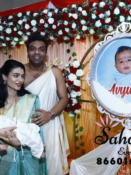 A personalized touch for a naming ceremony. We create custom-designed photo frames and signs to celebrate the new baby, surrounded by beautiful floral arrangements.