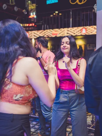 Two guests dancing together, lost in the music.