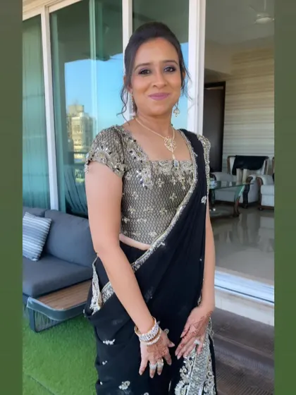 A stunning client in a classic black saree. I created a soft glam look with a subtle smokey eye to complement her elegant and timeless style.