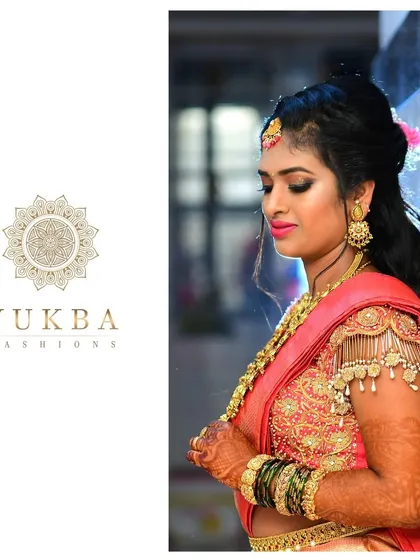 Another beautiful shot of our bride, showcasing the intricate embroidery and hanging tassels on the sleeves of her pink silk blouse. This is what a complete, personalized bridal look feels like.