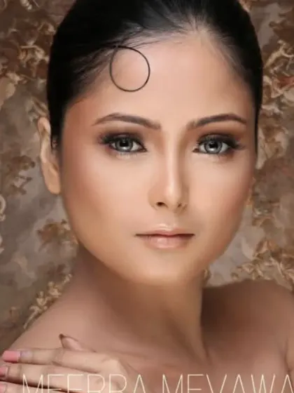A portfolio look on a medium skin tone, featuring a warm smokey eye and a perfectly matched foundation.