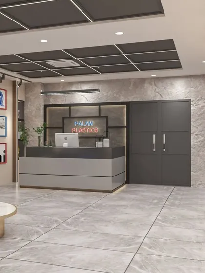 The reception area for Palam Plastics, showcasing the brand's identity with a clean, modern desk and professional signage.