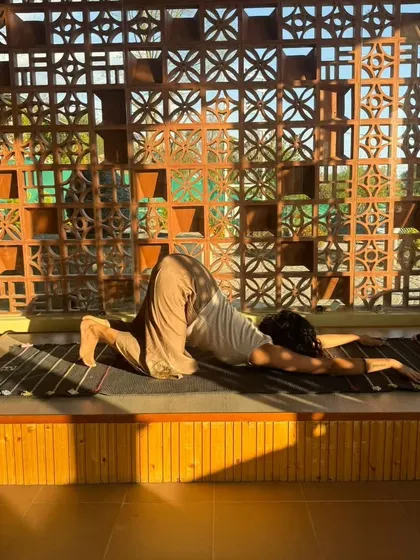 Sinking into a supported puppy pose during a restorative session. The goal here is to let go completely and allow the props to hold you.