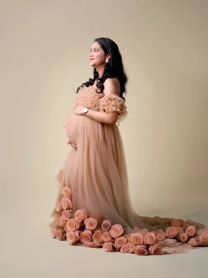 A full-length view of the popular rose-train gown, showcasing its unique design and elegant silhouette.