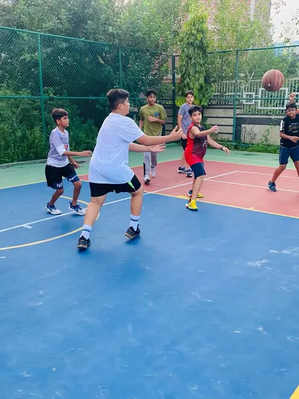 Players practice passing in a circle, a great drill for improving teamwork and awareness.