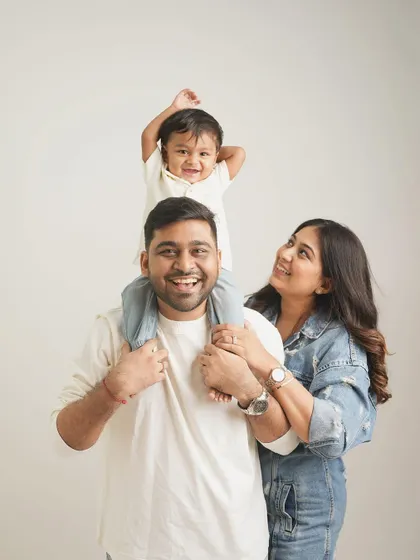 In my minimalist studio, your family is the entire focus. I love capturing the simple, happy moments, like this family portrait where the joy is so clear and genuine, creating a clean and timeless piece of art for your home.
