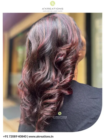 Another angle of the pink and red highlights, showing how the colors are woven through the hair for a multi-tonal effect.