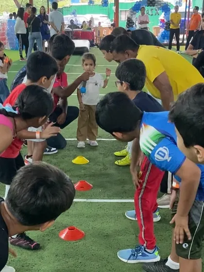 The little ones get ready for a fun face-off. Our coaches explain the rules of the next game, building anticipation and excitement during a fitness birthday party.