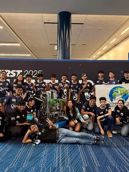 Team Kaizen 10428, in their rookie season, posing with their award-winning robot at the FIRST World Championship. Their success is a testament to our mentorship and their dedication to engineering excellence.