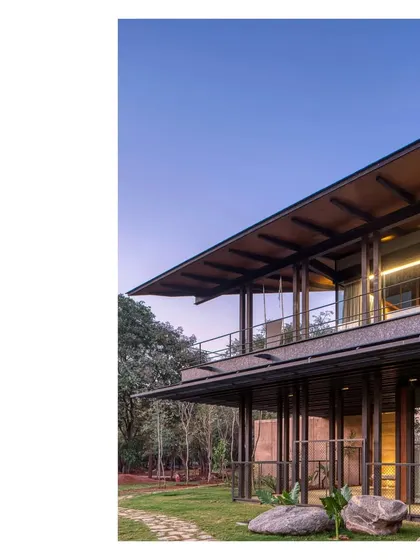 The completed Lakeshore house at dusk. The landscape will take a couple of years to fully mature, but the duet between the site and the architecture has already begun.
