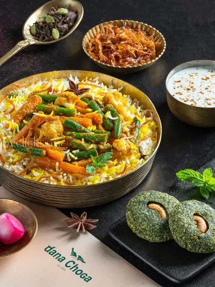 A vegetarian biryani from Dana Choga, served with hara bhara kabab and raita.