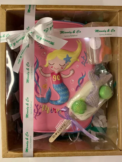 The ultimate mermaid-themed gift hamper, all packed and ready to delight. This box includes a mermaid pouch, a custom mermaid tail popsicle soap, and other themed goodies, showing how I can create a complete gifting experience for any occasion.