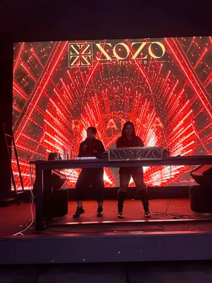 Sharing the stage with rapper Yaagaa for a Christmas bash at Xozo. Our collaboration brought a unique mix of live rap and DJ beats to the party.