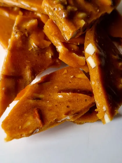 Pieces of our Smoked Almond Brittle, a unique filling with a smoky, sweet flavor.