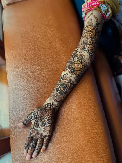 A complete view of a signature floral design on both arms, showcasing the intricate detail and full coverage that I offer for my brides.