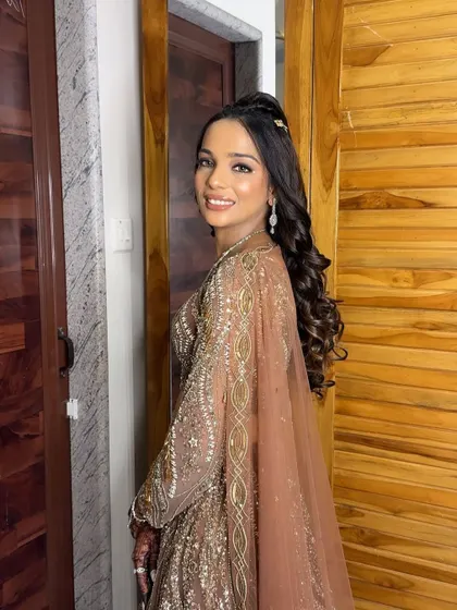 A side profile showing her glamorous makeup and sparkling diamond jewellery.