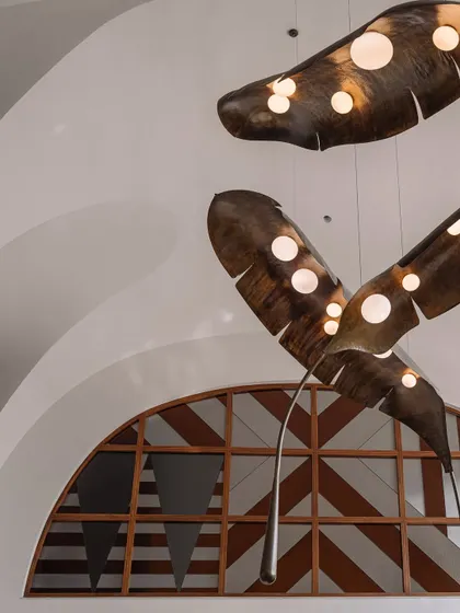 A portrait-oriented dump of various spaces in Rehethaan, including the L-shaped galleria, the informal living room, and details of the dramatic ceiling.