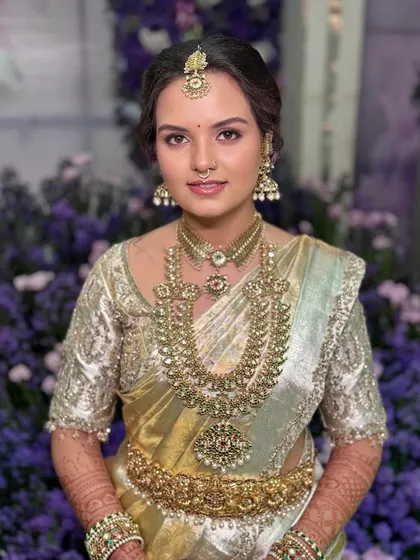 A close-up of Sushmitha's face, showing the seamless blend of her makeup.