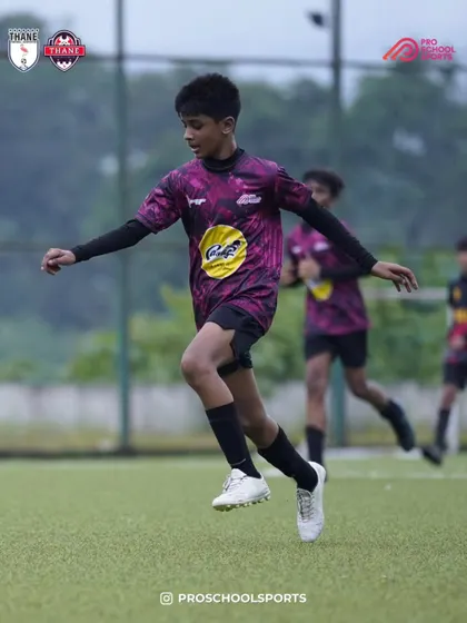 A player shows agility and speed while on the ball during a match.