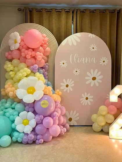 A groovy and fresh daisy-themed 2nd birthday for Eliana. The pastel rainbow balloon cascade, filled with adorable daisy balloons, created a cheerful and vibrant atmosphere.