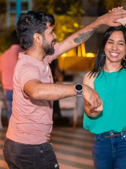 A happy spin with a big smile. The joy of dancing is clear.