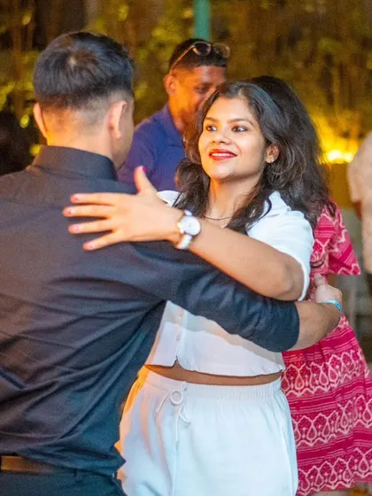 A close and connected dance with smiles all around.