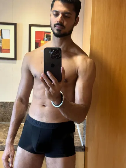 A close-up selfie showing my upper body definition.
