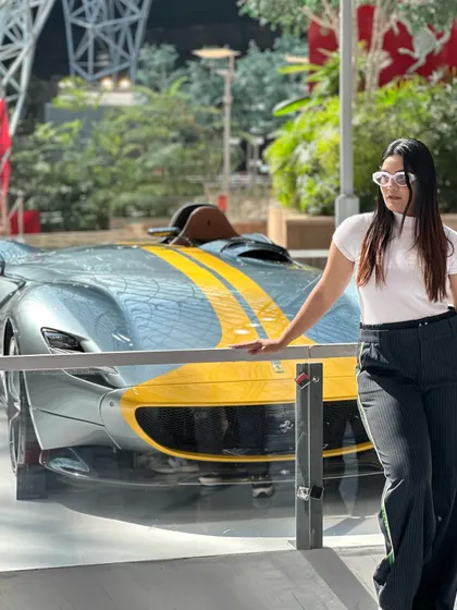 Posing with a stunning silver and yellow Ferrari. My monochrome outfit allows the car to be the star of the show.