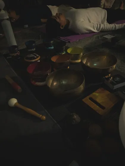 A close-up of some of the tools I use for sound therapy. This includes a variety of Tibetan singing bowls, a mallet, and a tingsha, each with a unique frequency and purpose.