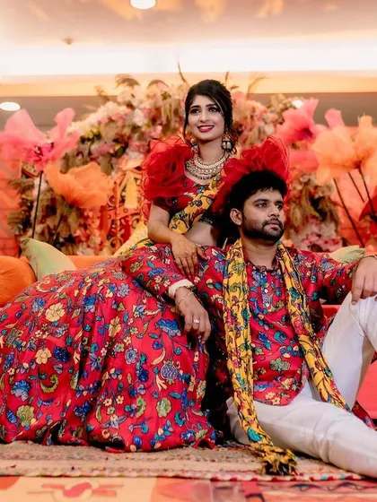 A lovely portrait of the couple during their Mehendi function. The decor, with its warm tones and eclectic elements, provides a stunning setting for their photos.