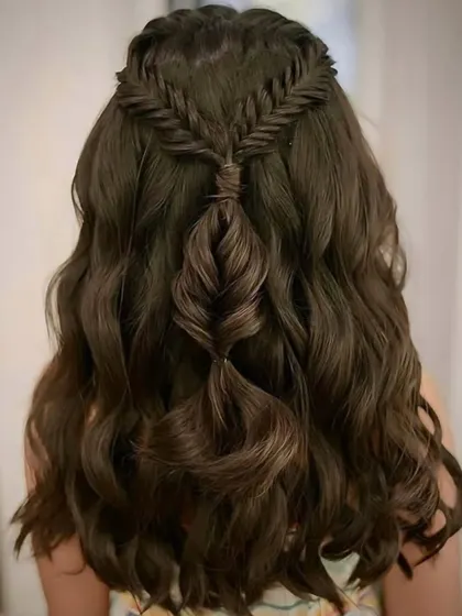 A detailed back view of the fishtail and pull-through braid combination, showcasing the artistry and skill involved in this style.