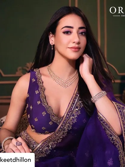 Another look from the same series, this time with a slightly different pose. The makeup remains the focal point, with a perfectly blended eyeshadow and a soft, matte lip.