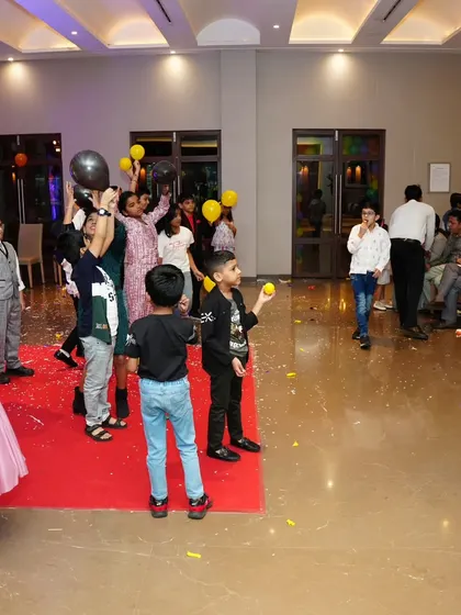 A classic balloon game in full swing. These simple, high-energy activities are perfect for getting all the kids on their feet and playing together.
