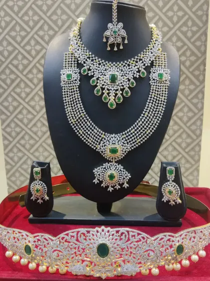 The complete American diamond and emerald bridal set, a popular choice for receptions.