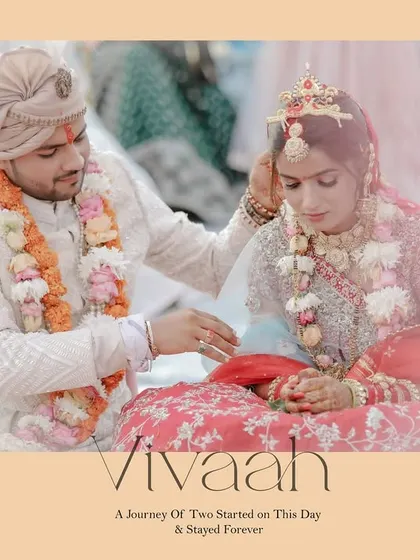 The groom applies sindoor to the bride's hair parting, a significant and emotional ritual of the Hindu wedding ceremony.