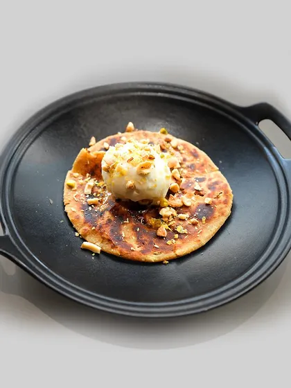 Our Mawa Mishri Parantha with Ginger Candy Ice Cream, a dessert inspired by the culinary traditions of Rajasthan.