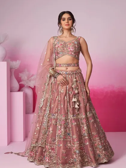 Soft, elegant, and perfect for a daytime wedding or engagement. This dusty pink lehenga features delicate multi-color floral embroidery. It’s a beautiful example of the pastel outfits for rent in my collection.