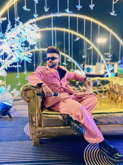 "Love is in the details, and so is the wedding style." This pink suit was a bold choice for a stylish evening event.