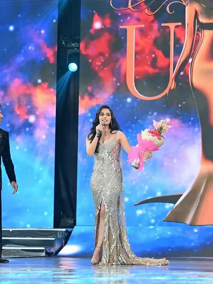 Capturing the glamour of a beauty pageant. This shot from the stage shows the excitement of the event and is a great addition to a model's portfolio to showcase experience.