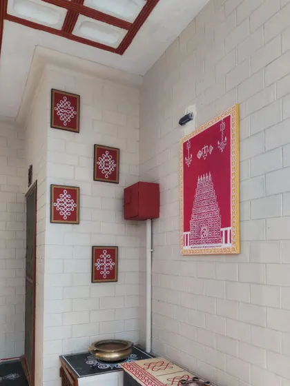 A complete view of the entrance makeover featuring Kolam art. We combined a large Tirupati inspired panel with smaller framed Kolam designs for a cohesive, traditional look.