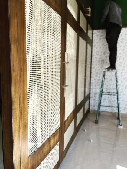 A timeless combination of veneer and rattan, finished with elegant brass handles. We built this wardrobe to be a classic, showcasing our ability to execute designs that are both stylish and built to last.