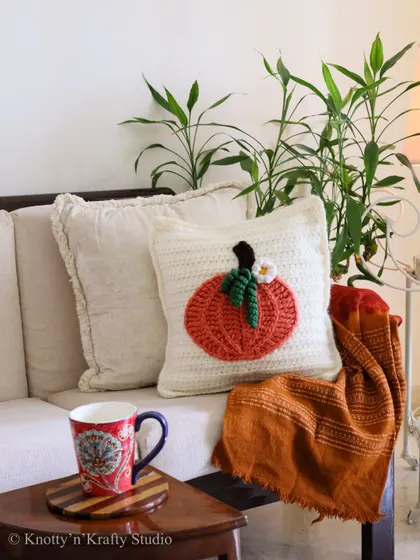 There's nothing quite like the colours of autumn to make a space feel cozy. This pumpkin-themed crochet cushion, with its rich orange and textured details, is perfect for snuggling up on the sofa with a warm drink and a good book as the seasons change.